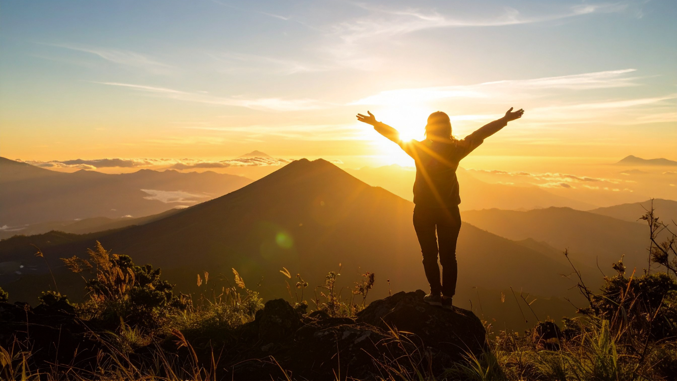 person silhouette sunrise expansive landscape